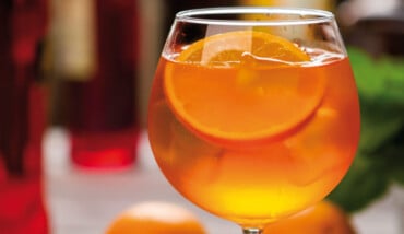 Orange Drink In Wineglass.