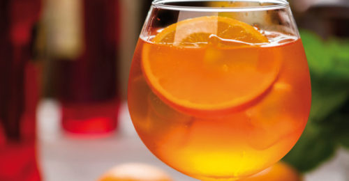 Orange Drink In Wineglass.