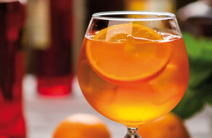 Orange Drink In Wineglass.