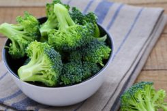 Fresh Broccoli In A Bowl On Rustic Table