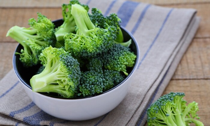 Fresh Broccoli In A Bowl On Rustic Table
