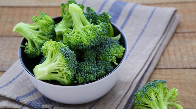 Fresh Broccoli In A Bowl On Rustic Table
