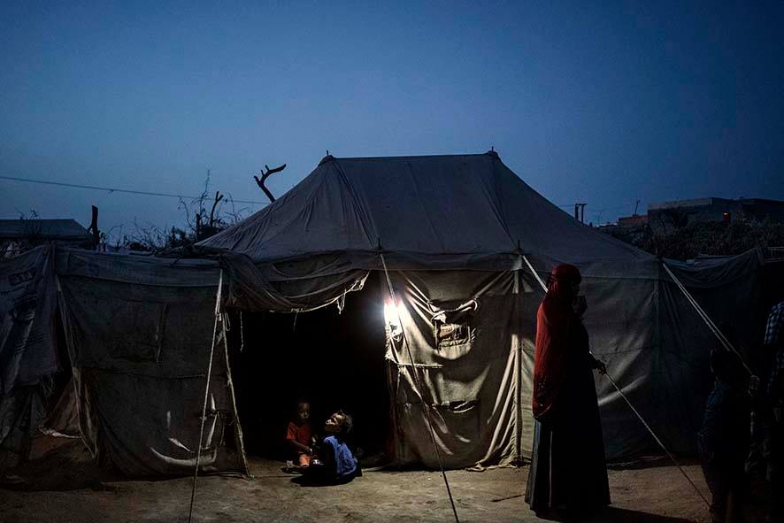 Children Sit At The Entrance To A Tent In A Camp For Internally Displaced People In Mashqafah, Near Aden, Yemen