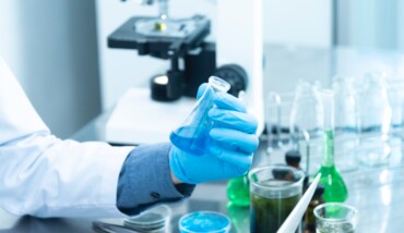 Person Holding Laboratory Flask 2280571