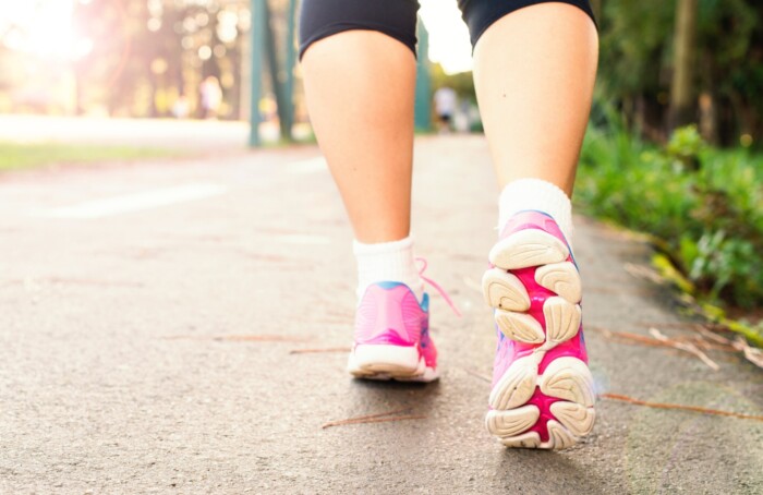 Photo Of Woman Wearing Pink Sports Shoes Walking 1556710