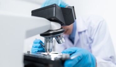 Scientist Using Microscope 3938022