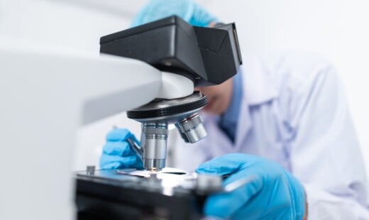Scientist Using Microscope 3938022