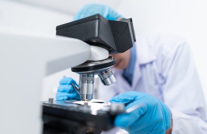 Scientist Using Microscope 3938022