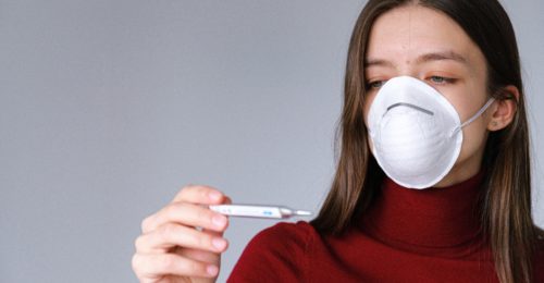 Woman In Face Mask Checking Thermometer 3987152