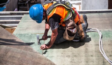 Man Wearing Blue Hard Hat Using Hammer 544966