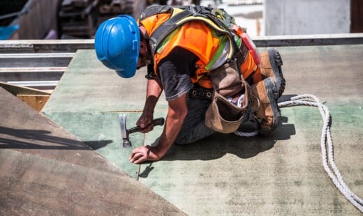 Man Wearing Blue Hard Hat Using Hammer 544966
