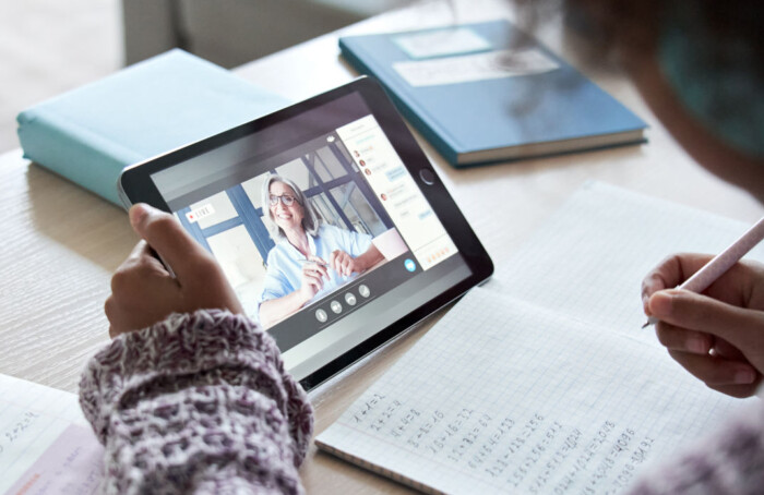 African Child Girl Holding Tablet Talking With Teacher On Distance Video Call.