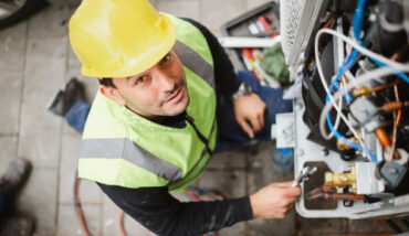 Air Conditioner Technician Services Outdoor AC Unit And The Gas Generator