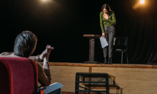 Selective Focus Of Theater Director And Bowing Actress On Stage